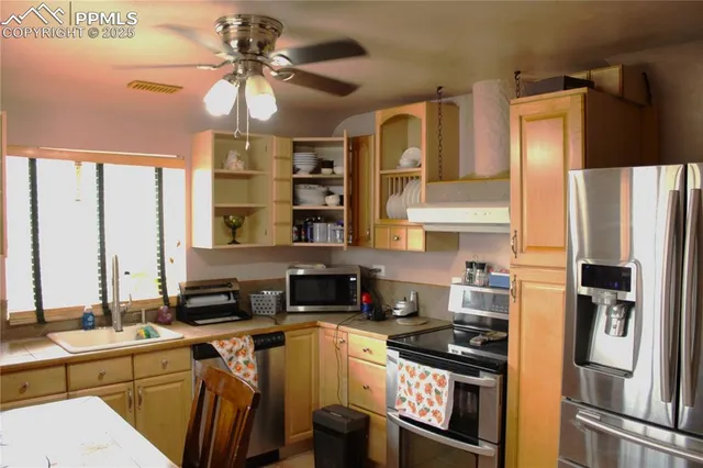 a view of a livingroom with furniture and a flat screen tv
