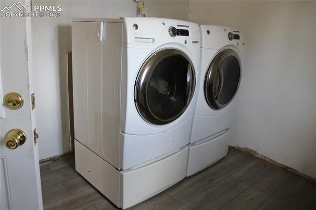 an aerial view of a residential apartment building with a yard