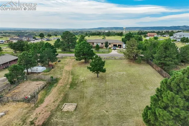 a view of a town with mountains in the background