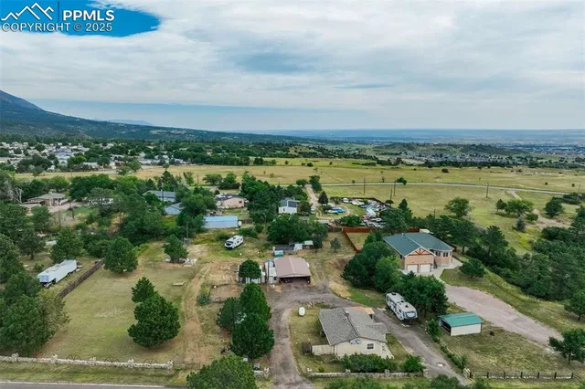 an aerial view of residential house with outdoor space