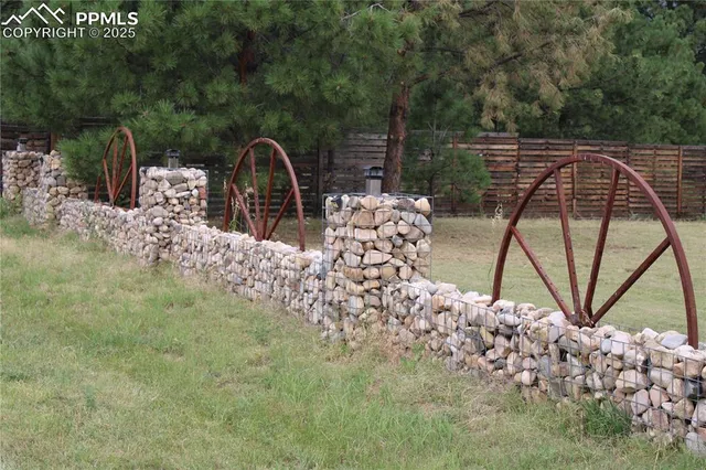 a view of a water fountain and a bench