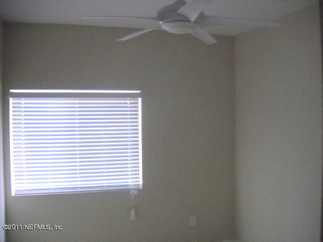9745 Touchton Road, Unit 2403 Jacksonville, FL 32246 - Photo 6 of 9 an empty room with a window