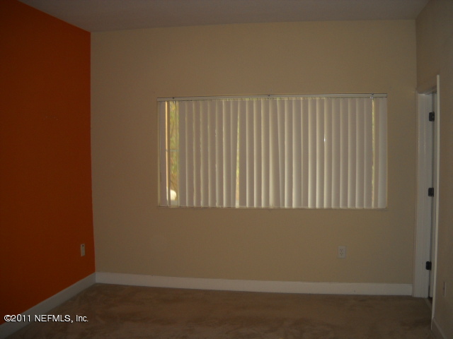 9745 Touchton Road, Unit 2403 Jacksonville, FL 32246 - Photo 7 of 9 an empty room with a window