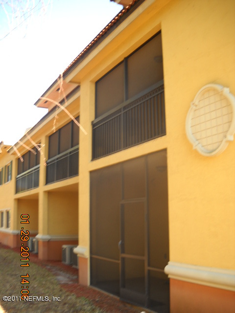 9745 Touchton Road, Unit 2403 Jacksonville, FL 32246 - Photo 9 of 9 a view of a house with a door and wooden floor