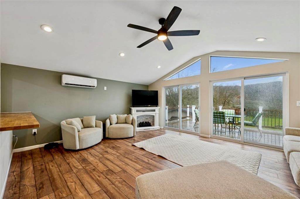 501 Highway 356 Apollo, PA 15613 - Photo 12 of 35 a living room with furniture a flat screen tv and a large window
