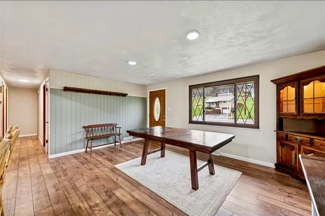 a view of a livingroom with furniture and a workspace