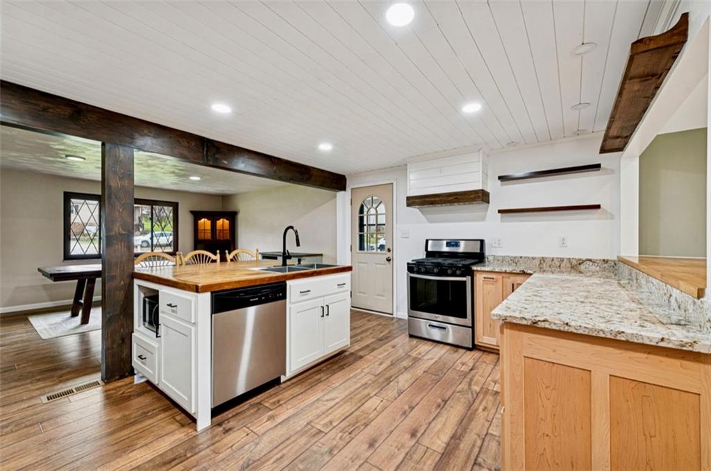 501 Highway 356 Apollo, PA 15613 - Photo 10 of 35 a kitchen with stainless steel appliances granite countertop a stove and a sink