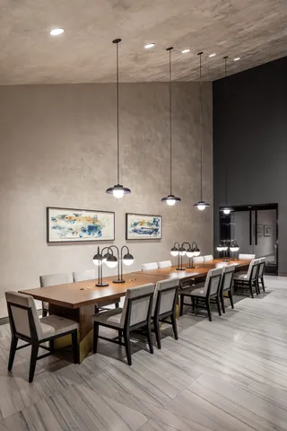 a dinning table and chairs in a kitchen