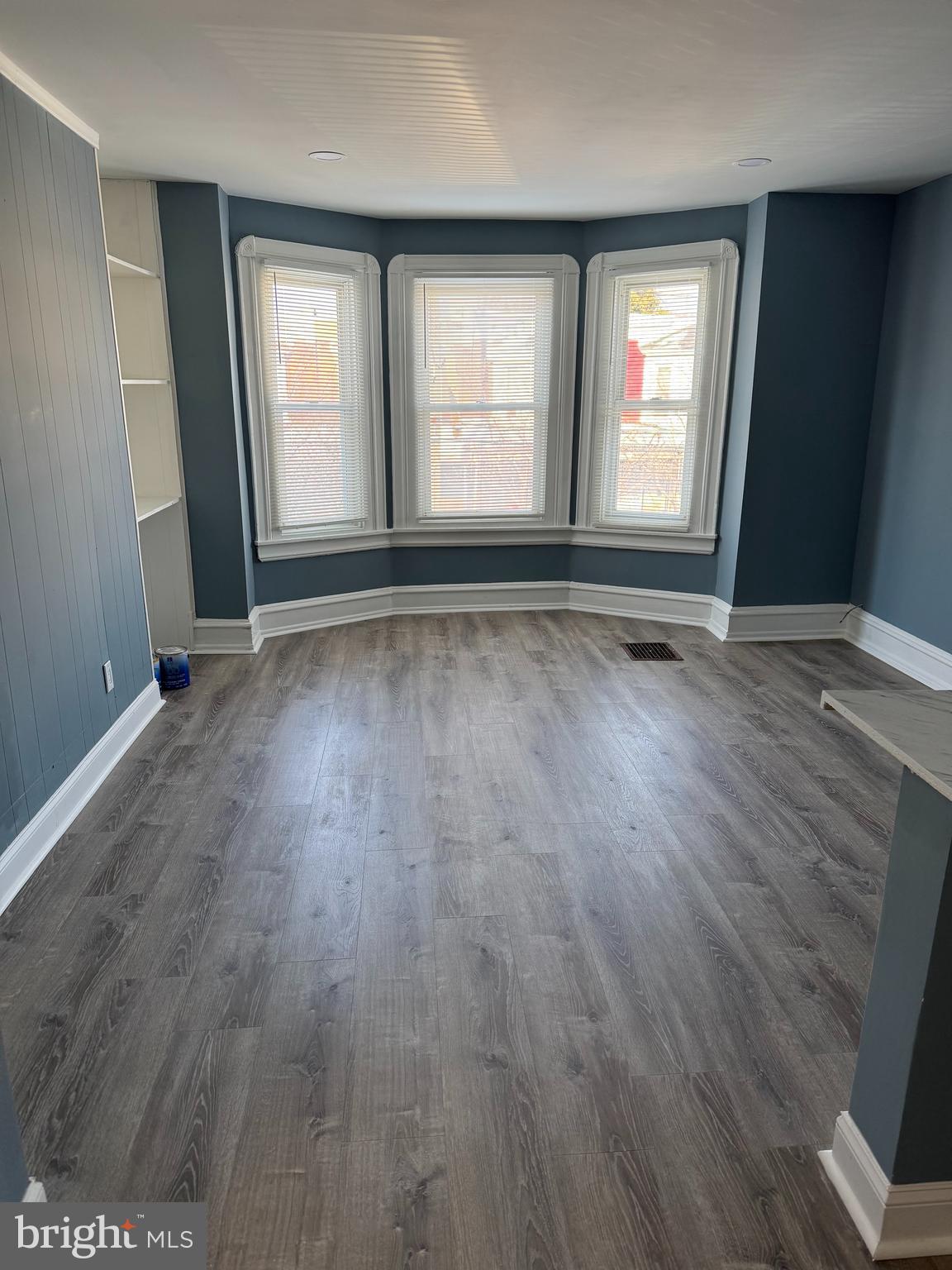 5332 Pine Street, Unit 2 Philadelphia, PA 19143 - Photo 1 of 21 an empty room with wooden floor and windows