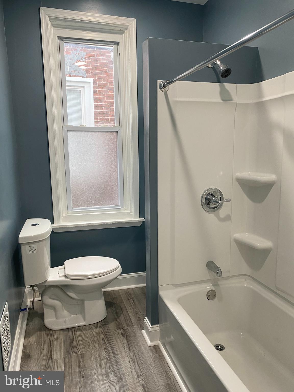 5332 Pine Street, Unit 2 Philadelphia, PA 19143 - Photo 11 of 21 a bathroom with a toilet and a shower