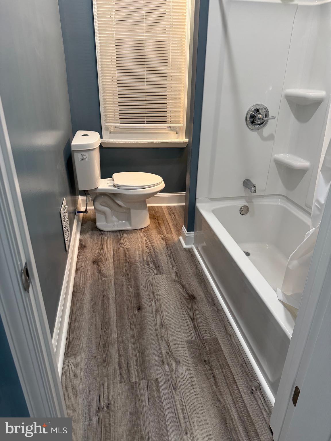 5332 Pine Street, Unit 2 Philadelphia, PA 19143 - Photo 12 of 21 a bathroom with a toilet a sink and a bathtub