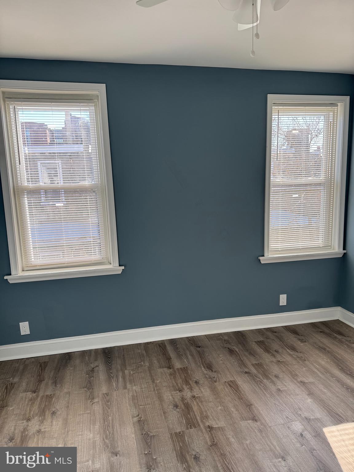 5332 Pine Street, Unit 2 Philadelphia, PA 19143 - Photo 18 of 21 a view of an empty room with wooden floor and a window