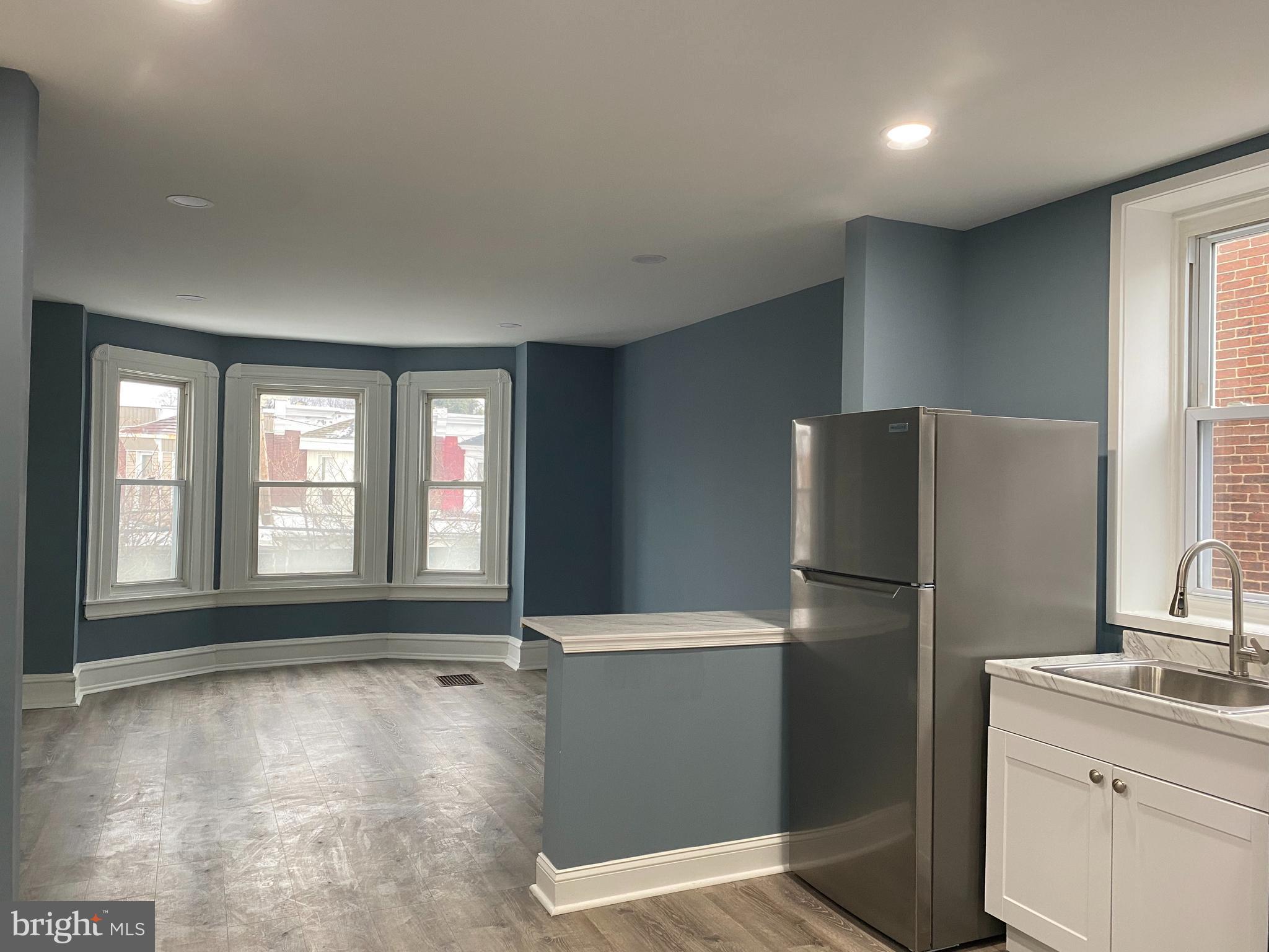 5332 Pine Street, Unit 2 Philadelphia, PA 19143 - Photo 3 of 21 a kitchen with a refrigerator and a sink