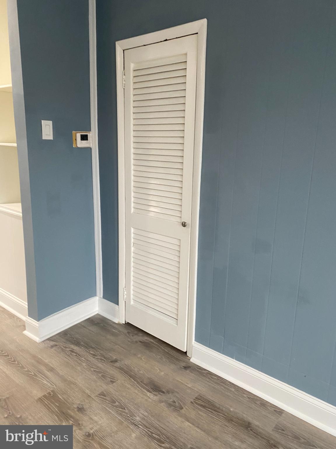 5332 Pine Street, Unit 2 Philadelphia, PA 19143 - Photo 5 of 21 an empty room with wooden floor and closet
