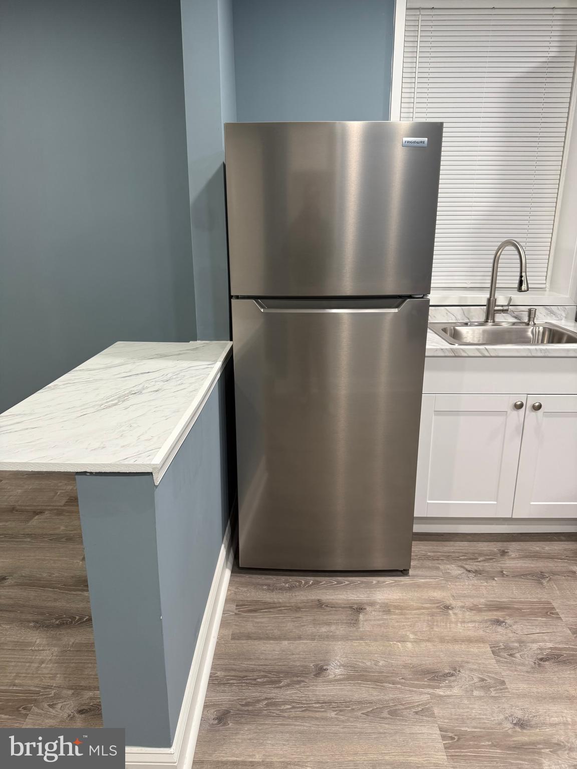 5332 Pine Street, Unit 2 Philadelphia, PA 19143 - Photo 8 of 21 a white refrigerator freezer sitting in a kitchen