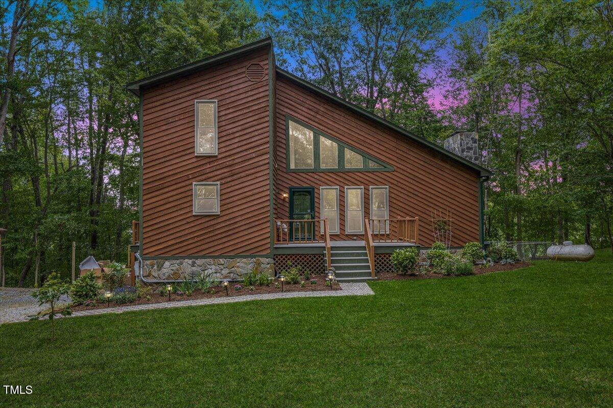 a front view of a house with garden
