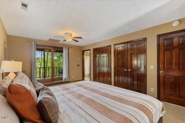 a view of a chair and tables in the balcony