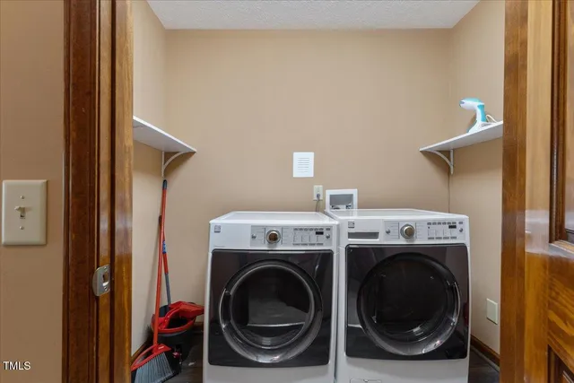 a view of a livingroom with furniture and windows
