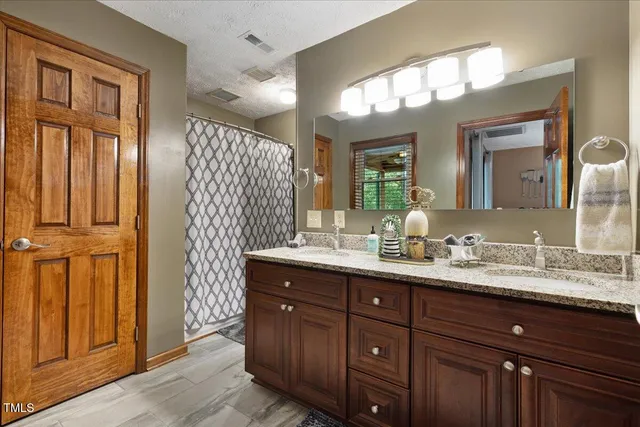 a balcony with wooden floor and outdoor seating