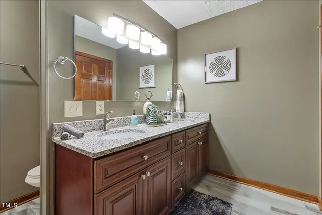 a view of a two chairs in the balcony