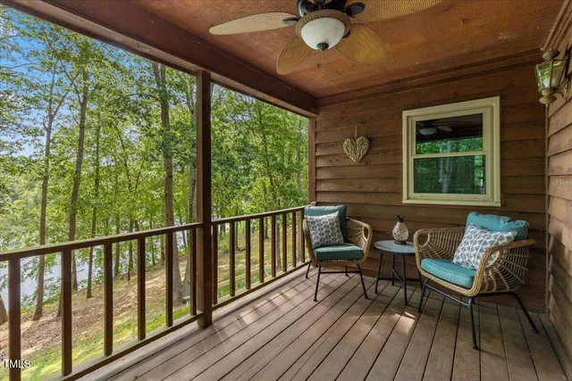 a view of a balcony with chairs