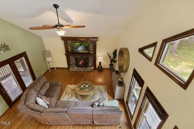 a bathroom with a granite countertop toilet sink and mirror