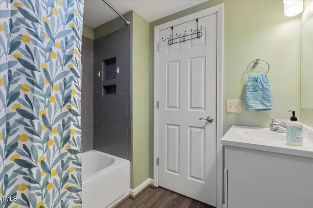 a bedroom with a bed and a lamp