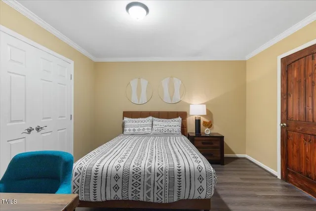 a view of a patio with table and chairs and couches with wooden floor and fence