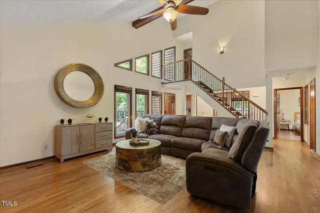 a bathroom with a granite countertop toilet and a sink