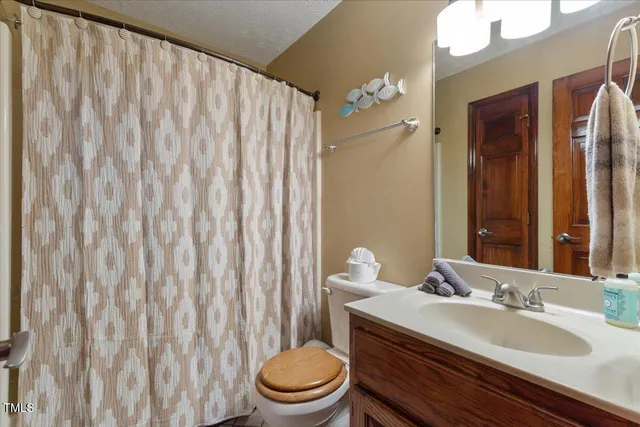 a bedroom with a bed and a table