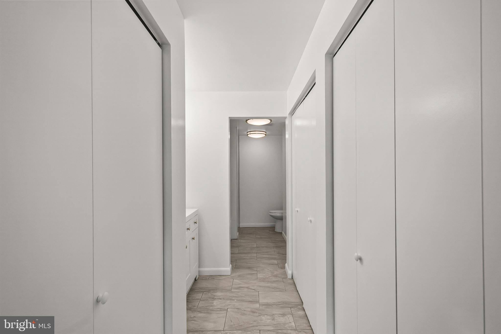 3601 Clarks Lane, Unit 322 Baltimore, MD 21215 - Photo 12 of 38 Primary bedroom closets and 1 of 2 double sinks.