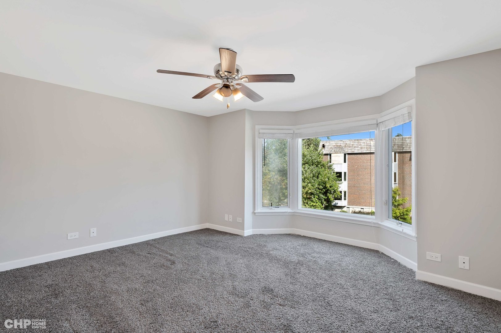 201 Thames Parkway, Unit 2F Park Ridge, IL 60068 - Photo 15 of 19 a view of room with a ceiling fan and window