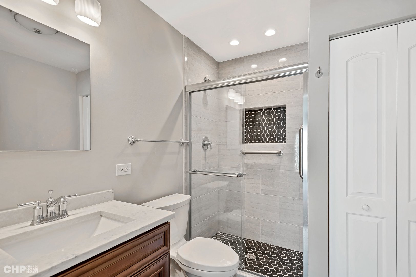 201 Thames Parkway, Unit 2F Park Ridge, IL 60068 - Photo 16 of 19 a bathroom with a sink a toilet and shower
