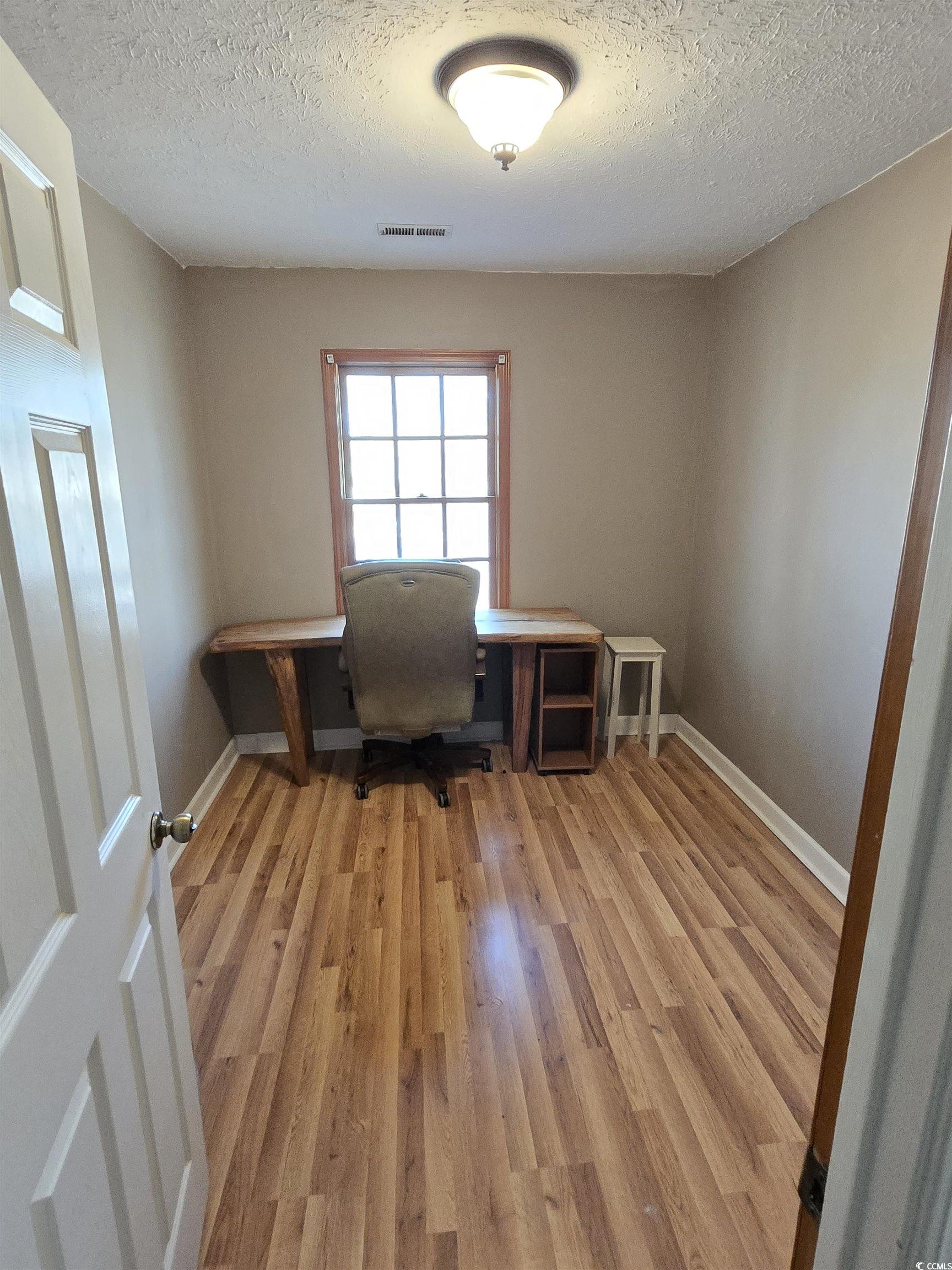 830 44th Avenue North Myrtle Beach, SC 29577 - Photo 10 of 13 Office space with light wood-style floors and a textured ceiling