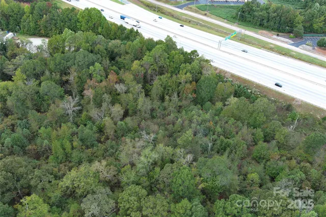 a view of a yard with a street view