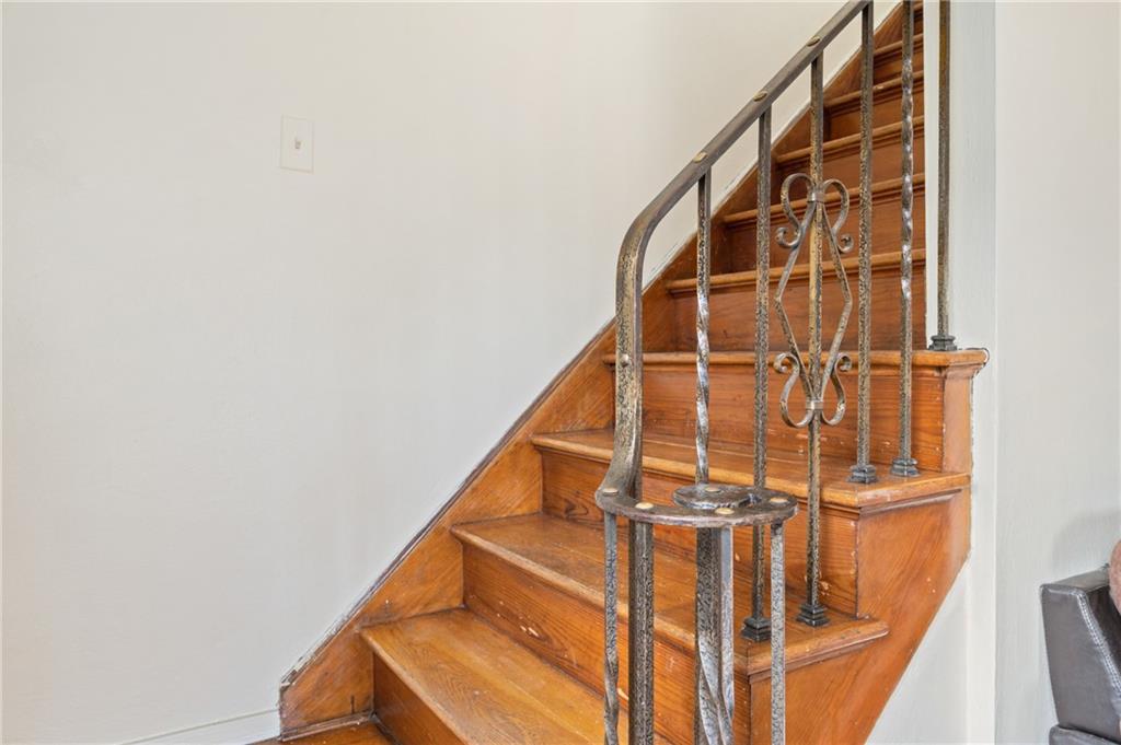 105 Delafield Road Pittsburgh, PA 15215 - Photo 12 of 18 a view of staircase with white walls and a window