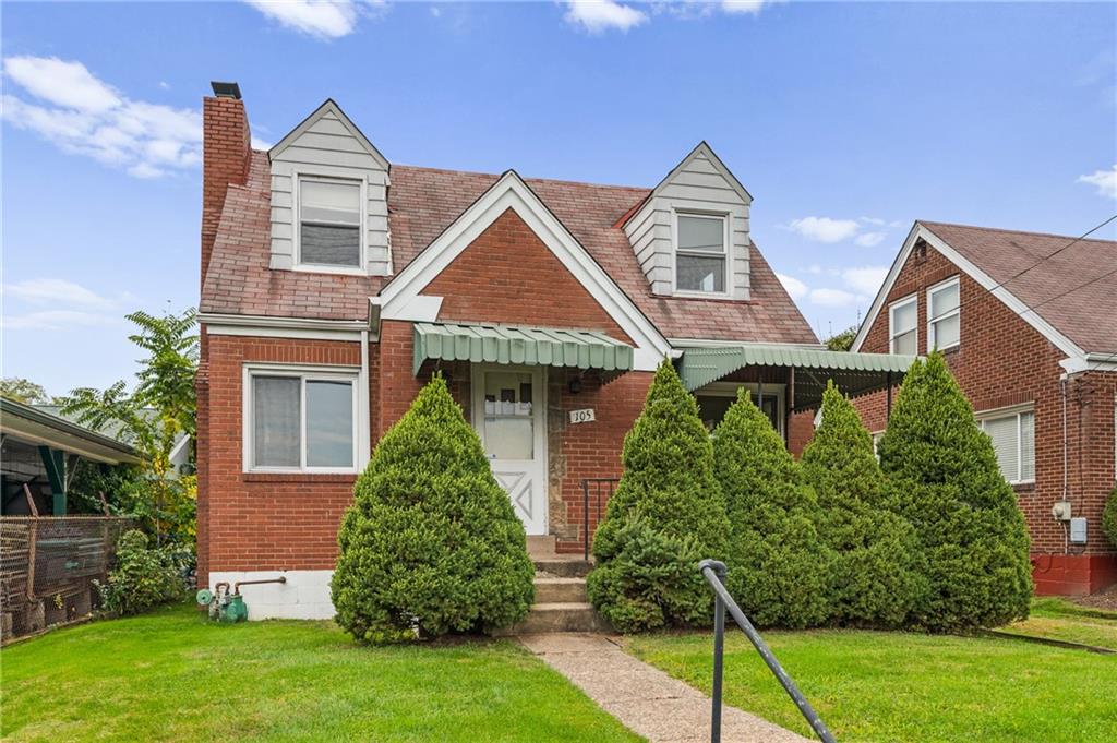 105 Delafield Road Pittsburgh, PA 15215 - Photo 2 of 18 front view of house with a yard