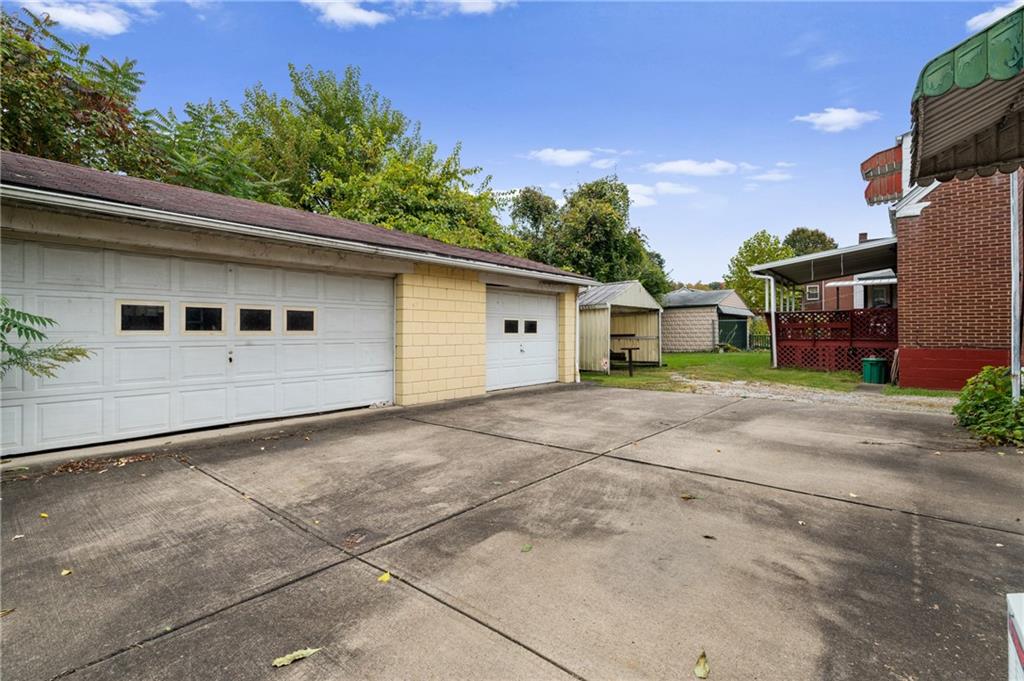 105 Delafield Road Pittsburgh, PA 15215 - Photo 5 of 18 a view of a house with a backyard and trees
