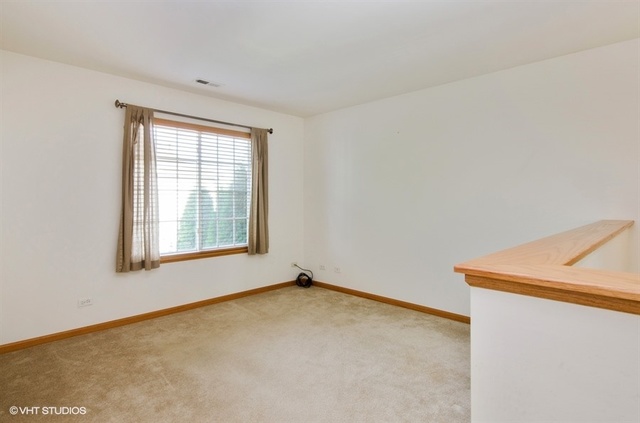 296 Evergreen Circle Gilberts, IL 60136 - Photo 4 of 10 an empty room with a window