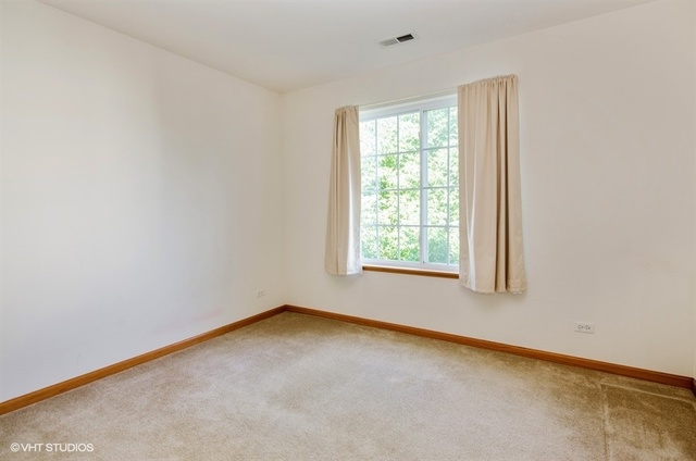 296 Evergreen Circle Gilberts, IL 60136 - Photo 7 of 10 an empty room with a window