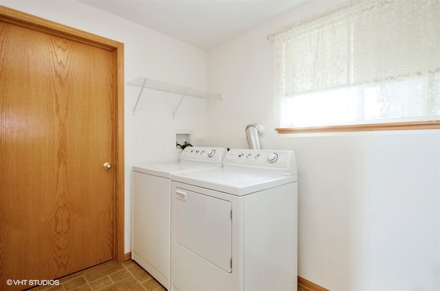 296 Evergreen Circle Gilberts, IL 60136 - Photo 9 of 10 a utility room with a sink a window and a shower