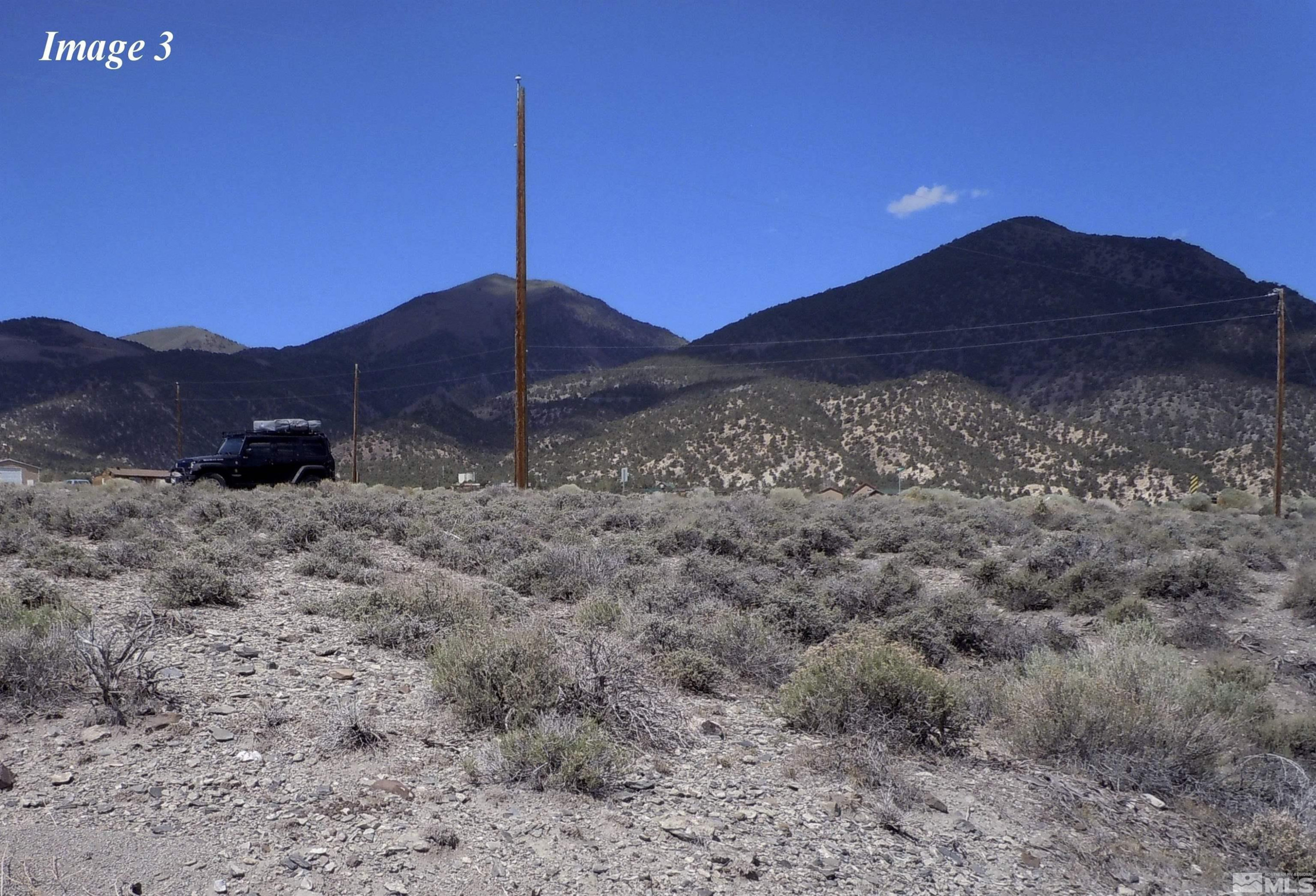 211-213 Kingston Canyon Road Kingston, NV 89310 - Photo 3 of 8 a view of a house with a mountain and a forest