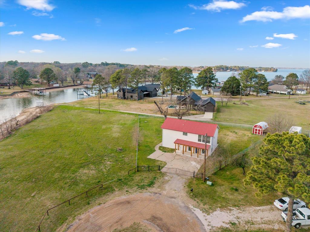 a view of a lake with a house in the background