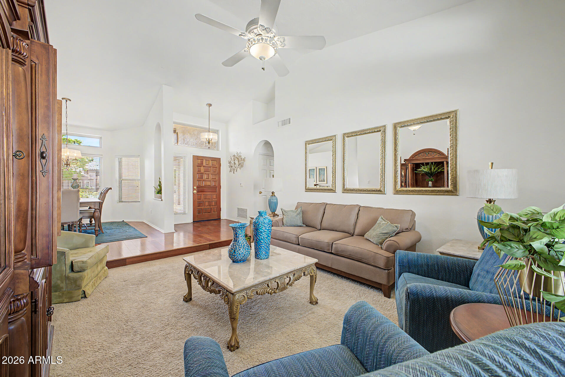 1924 East El Freda Road Tempe, AZ 85284 - Photo 5 of 56 a living room with furniture a lamp and a chandelier