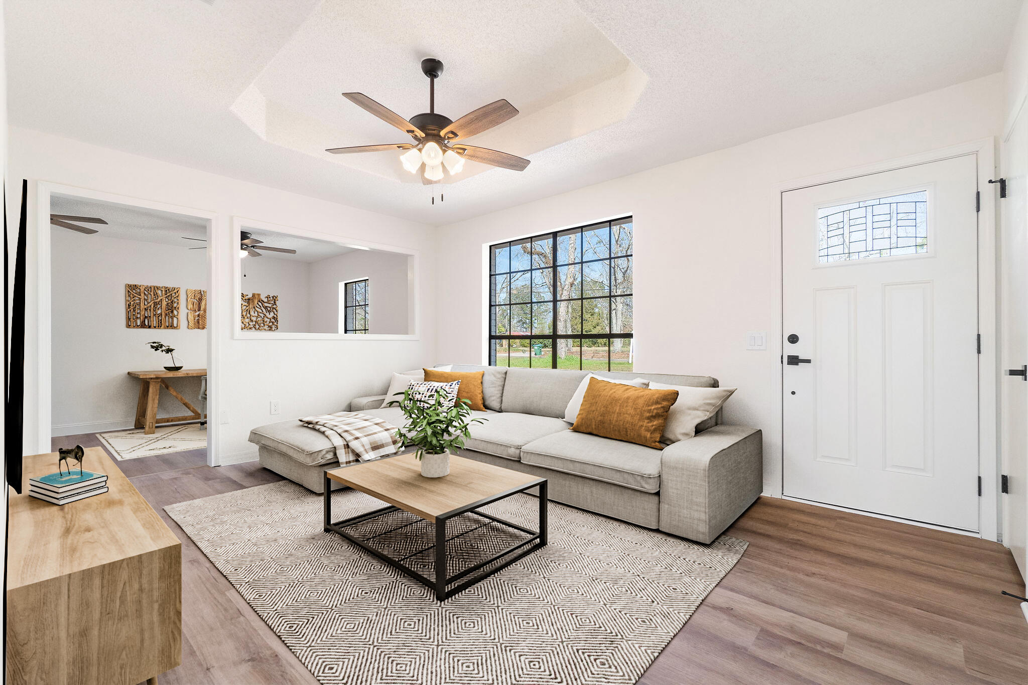 a living room with furniture and a large window