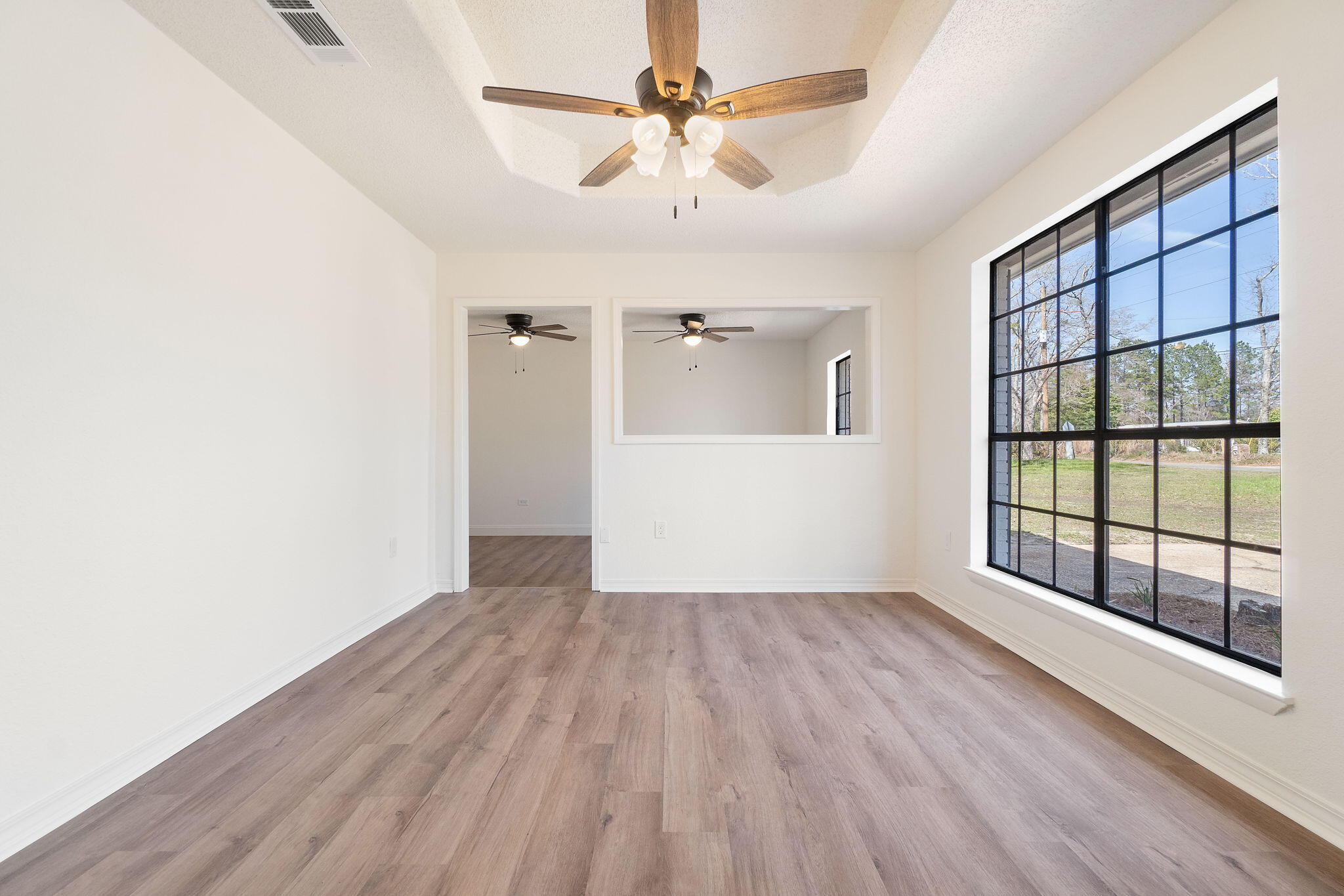 6118 Buckward Road Baker, FL 32531 - Photo 13 of 39 wooden floor in an empty room with a window