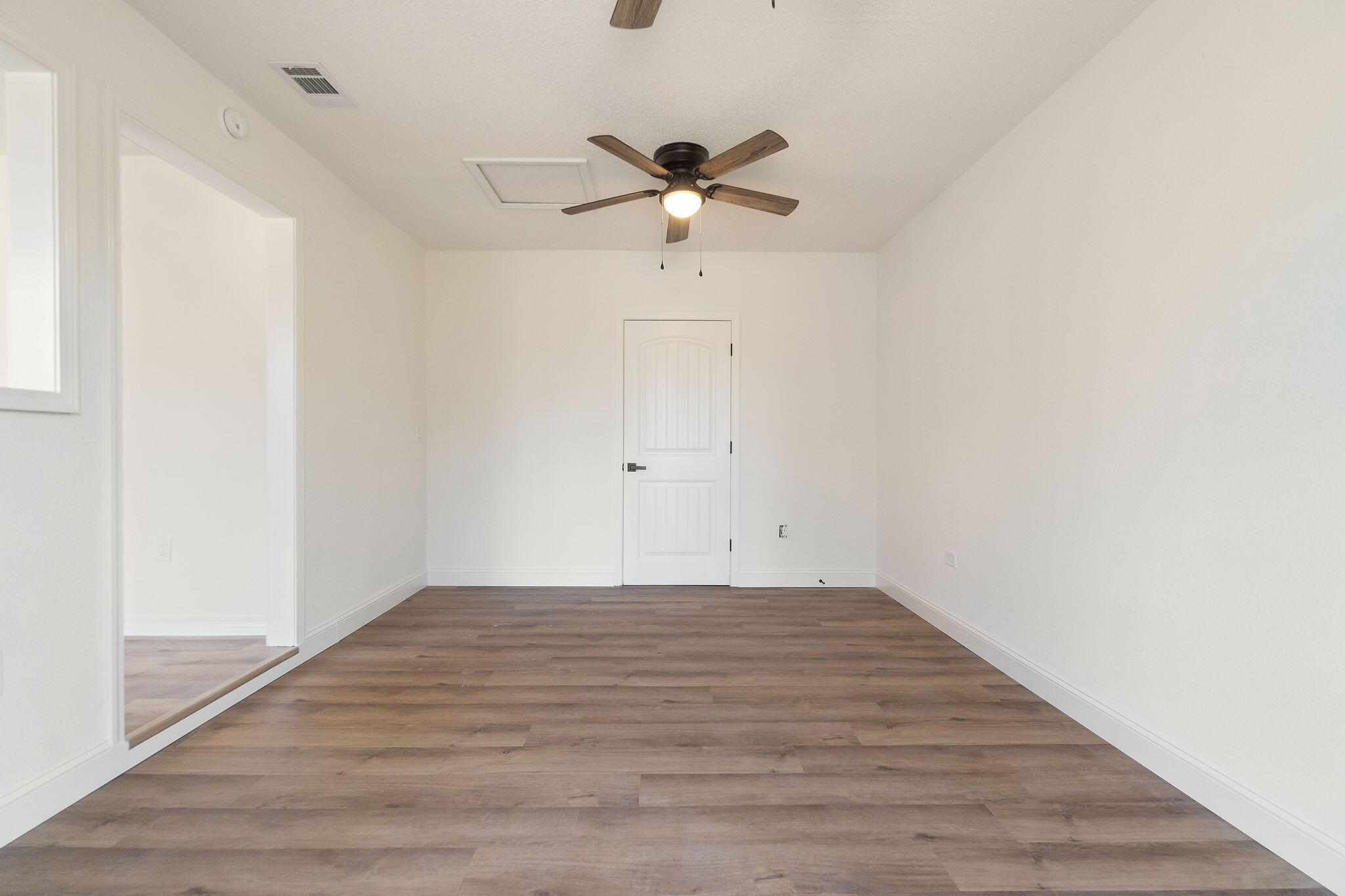 6118 Buckward Road Baker, FL 32531 - Photo 14 of 39 a view of empty room with wooden floor