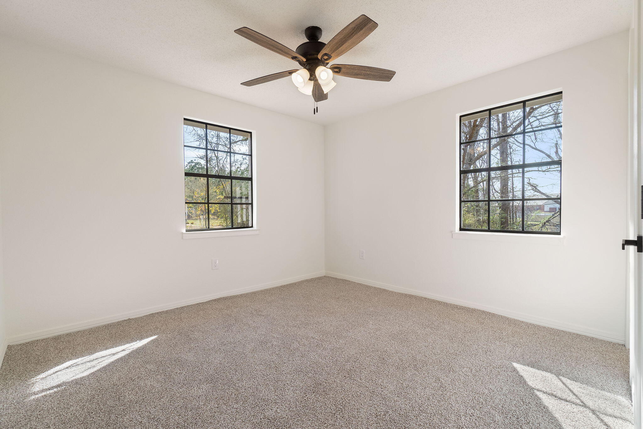 6118 Buckward Road Baker, FL 32531 - Photo 21 of 39 an empty room with windows and ceiling fan
