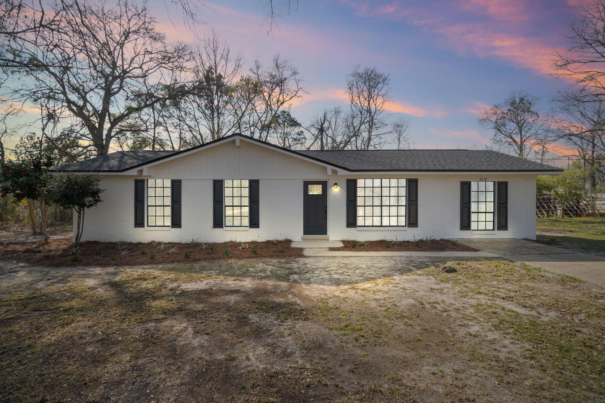 6118 Buckward Road Baker, FL 32531 - Photo 25 of 39 a big house with a big yard and large trees