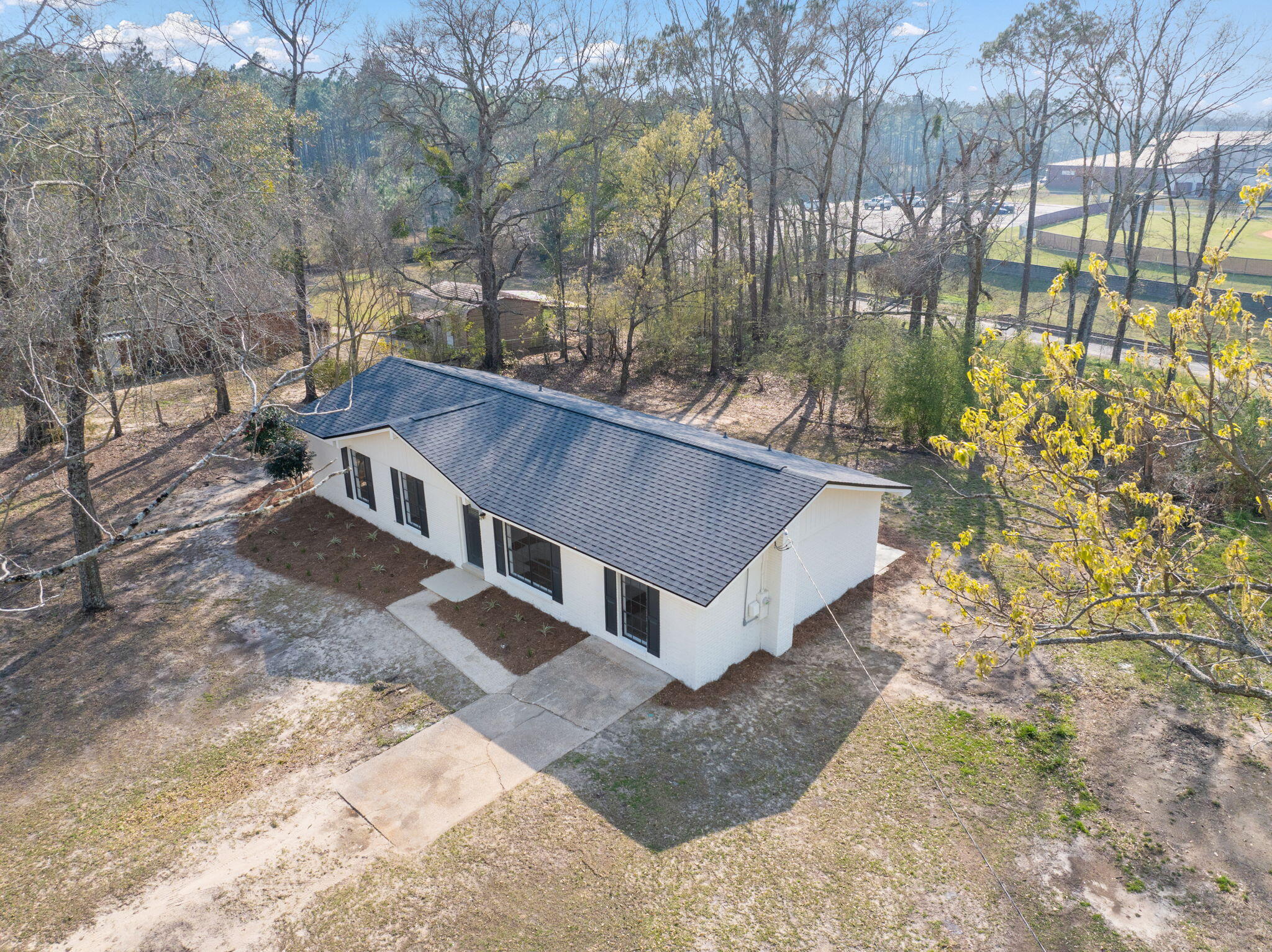6118 Buckward Road Baker, FL 32531 - Photo 30 of 39 a view of a house with a yard